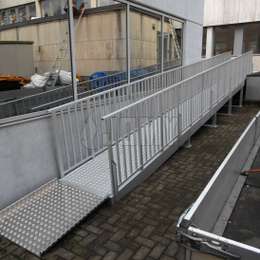 Angled wheelchair ramp for disabled access Angled wheelchair ramp in aluminium for building access.